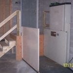 Unenclosed Vertical Platform Lift in Garage